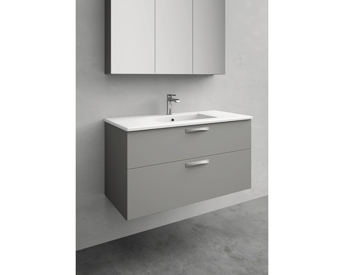 Tvättställsskåp med tvättställ och spegelskåp i badrummet