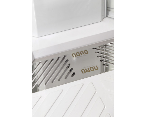 Detaljvy av badrumsmöbel med Noro-logotypen