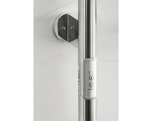 Detaljvy av en handdukstork med manöverelement