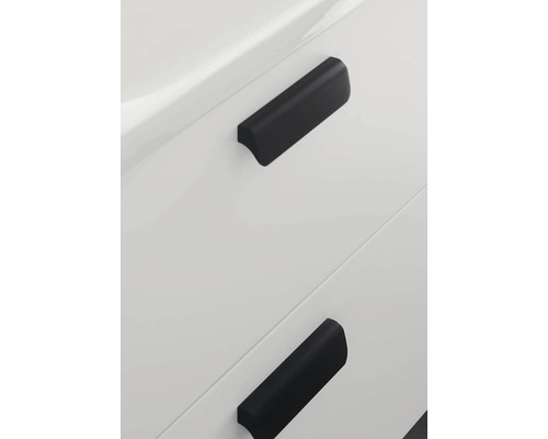 Detaljvy av två lådhandtag på en möbel