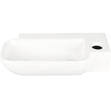 Vitt keramiskt handfat med förvaringsutrymme och kranhål