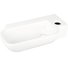 Vitt handfat i keramik med kranhål