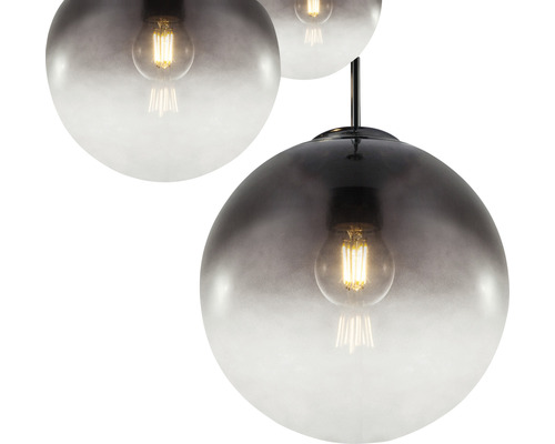 Pendellampa med runda glasskärmar och synliga glödlampor.