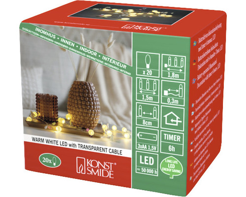 Ljusslinga KONSTSMIDE dekoration gröna löv, bär 20 varmvita LED timer 6h 1,6m 3xAA Förpackning med varmvit LED-ljusslinga med transparent kabel för inomhusbruk