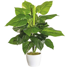 Konstgjord krukväxt i vit kruka