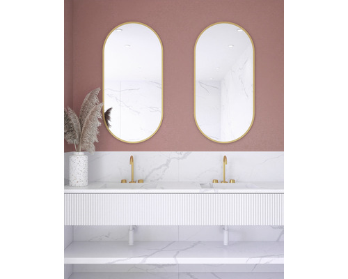 Badrum med två ovala speglar, underskåp för handfat och dekor