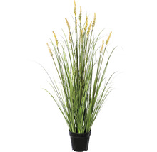 Konstgjort gräs med blommor i en kruka