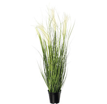 Dekorativ konstgjord växt med gröna blad och vita blommor i kruka