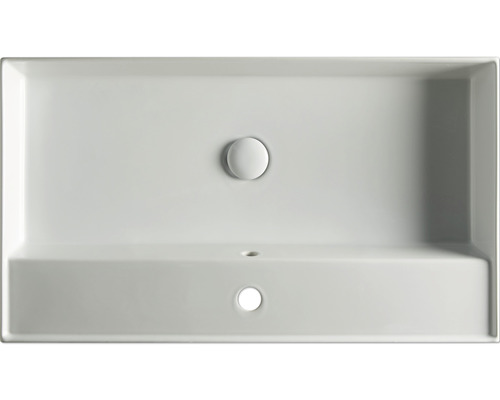 Övervy av ett rektangulärt tvättställ i keramik med avloppsplugg