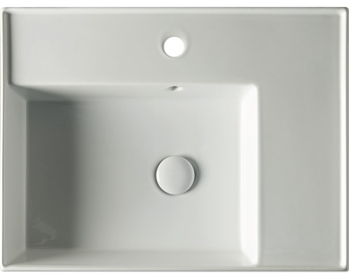 Vy från ovan på ett rektangulärt tvättställ i keramik med överlopp