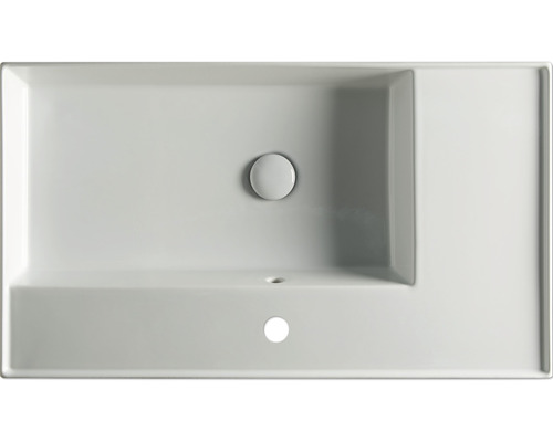 Toppvy av ett rektangulärt tvättställ i keramik med blandarhål