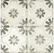 Mönster av fyra sammankopplade plattor med en geometrisk blomdesign