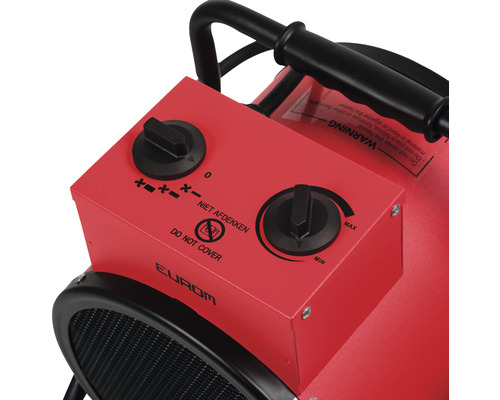 Detaljvy av en röd elvärmare med kontrollknappar