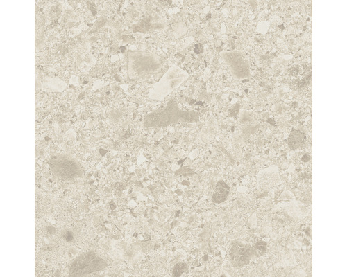 Närbild av en golvplatta med terrazzo-utseende.