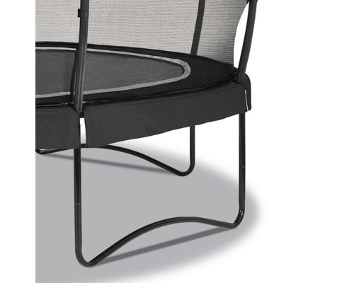 Detaljvy av en studsmatta med säkerhetsnät och benstöd.