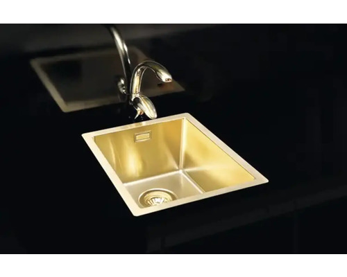 Diskho i rostfritt stål med kran på mörk yta