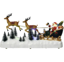 Juldekoration med jultomten i släde och renar