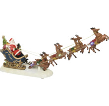 Dekorativ julscen med jultomten och rensläde