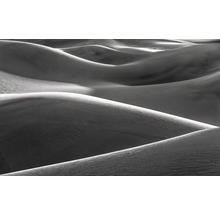 Abstrakt bild av sanddyner med ljus och skugga