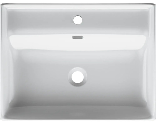 Överifrån på ett vitt keramiskt tvättställ