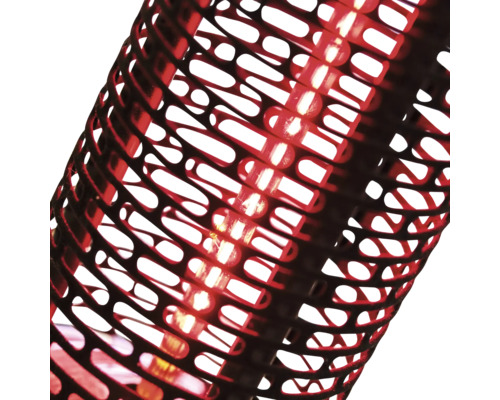 Detaljvy av en lampa med dekorativ, öppen lampskärm