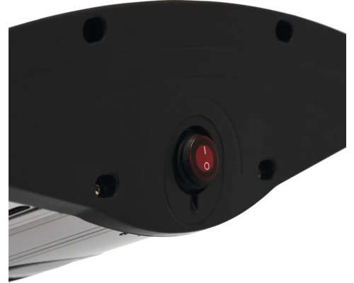 Närbild av baksidan av en värmelampa med röd på- och avstängningsknapp