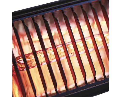 Närbild av ett tänt värmerör bakom ett skyddsgaller