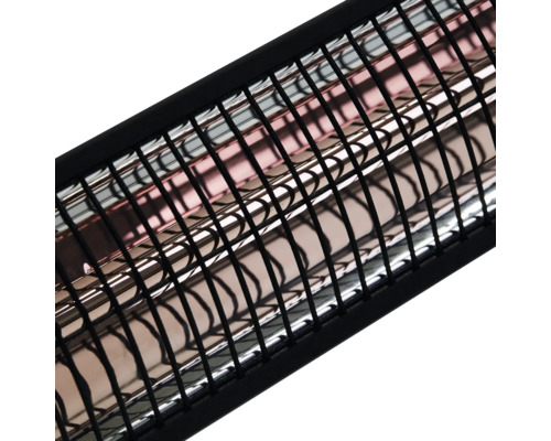 Detaljvy av en värmelampa med skyddsgaller