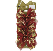 Tre röda rosetter med gyllene blommönster för dekoration