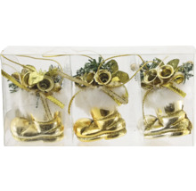 Tre guldfärgade julstrumpdekorationer i en transparent förpackning.
