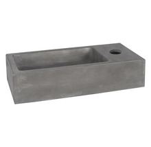 Grått tvättställ i betong för bänkmontage