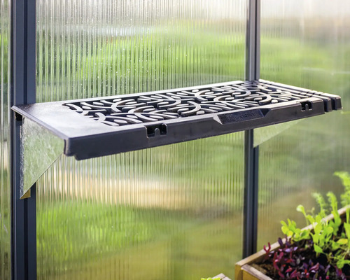 Svart växthushylla med blommönster på en växthusvägg