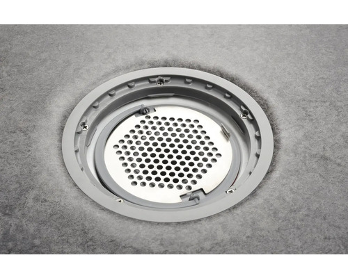 Golvbrunn med runt lock och perforeringsmönster