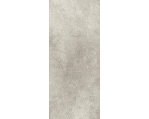 Detaljvy av en ljus keramisk platta med matt yta och diskret marmorering