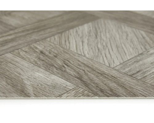 Närbild av vinylgolv i fiskbensmönster