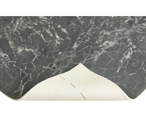 Närbild av en vinylgolvplatta med marmormönster.