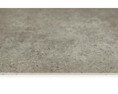 Närbild av en grå golvplatta med matt finish.