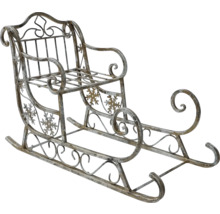 Dekorativ släde av metall med snöflingemönster