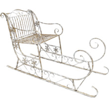 Dekorativ kälke i metall med sittplats och snöflingamotiv