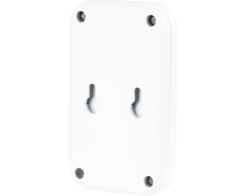 Baksida av en rektangulär, vit enhet med skruvar och hängande hål