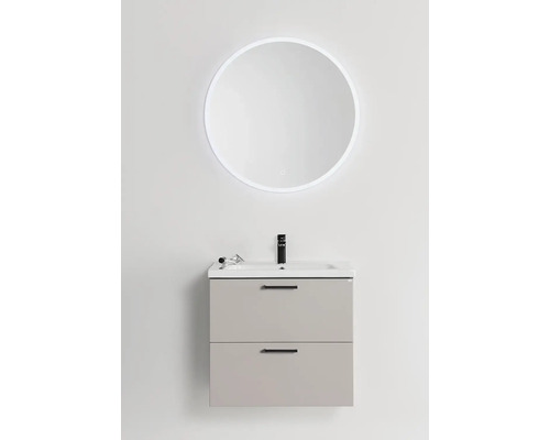 Tvättställ med rund spegel och LED-belysning i badrummet