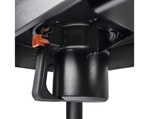 Detaljvy av en fettuppsamlingsenhet under en grill.