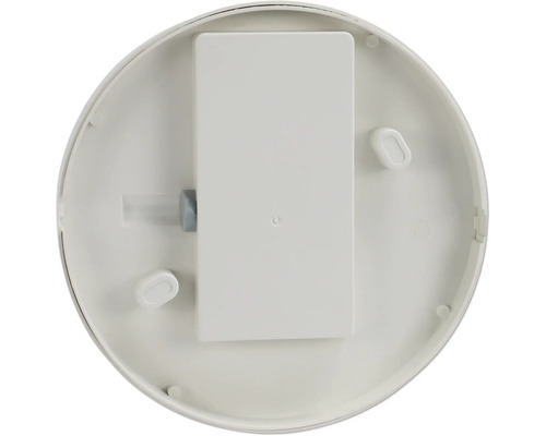 Undersida av en rökdetektor med batterifack