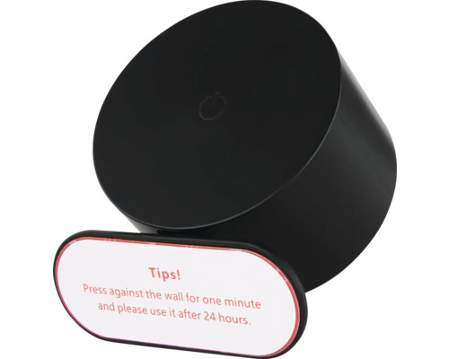 Svart, cylindrisk självhäftande föremål med instruktionsetikett