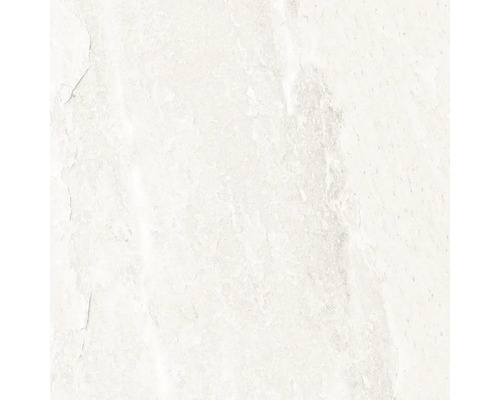 Närbild av en ljus väggplatta med en matt yta