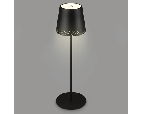 Svart bordslampa med gult ljus