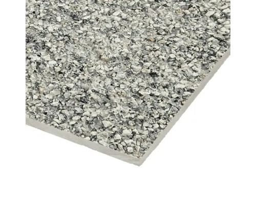 Närbild av en golvplatta med sten dekor