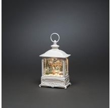 Dekorativ, belyst snöglobslykta med vinterlandskapstema