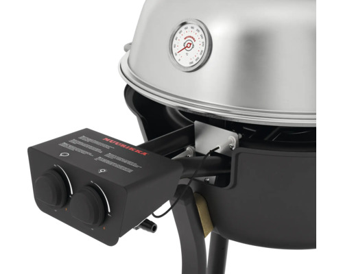 Detaljvy av en Muurikka grill med termometer och kontrollpanel