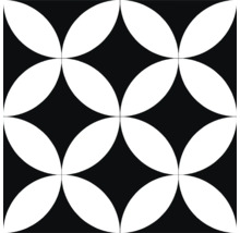 Dekorativ platta med blommönster i svart och vitt